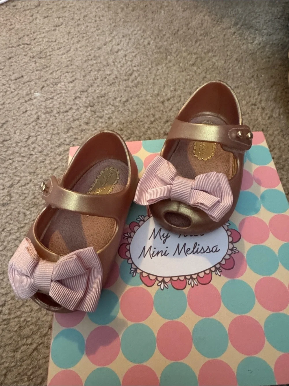 Mini Melissa Metallic Rose Gold Mary Janes with Pink Fabric Bows. Used w/box